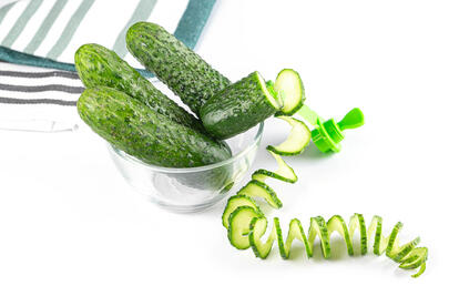 Whole fresh cucumbers in a glass bowl and cucumber spiral | Flickr