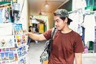 Japanese Tourist Enjoying Sightseeing Exploring City and Buy Postcards at  Tha Pae Walking Street, Chiang Mai Province, Thailand Stock Image - Image  of city, market: 157180125
