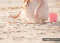 Girl looking for seashells — side view, softness - Stock Photo | #140013108