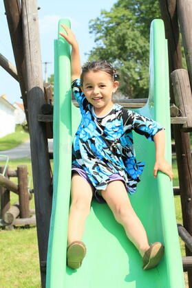 Little girl on a slide stock image. Image of cute, child - 32827049
